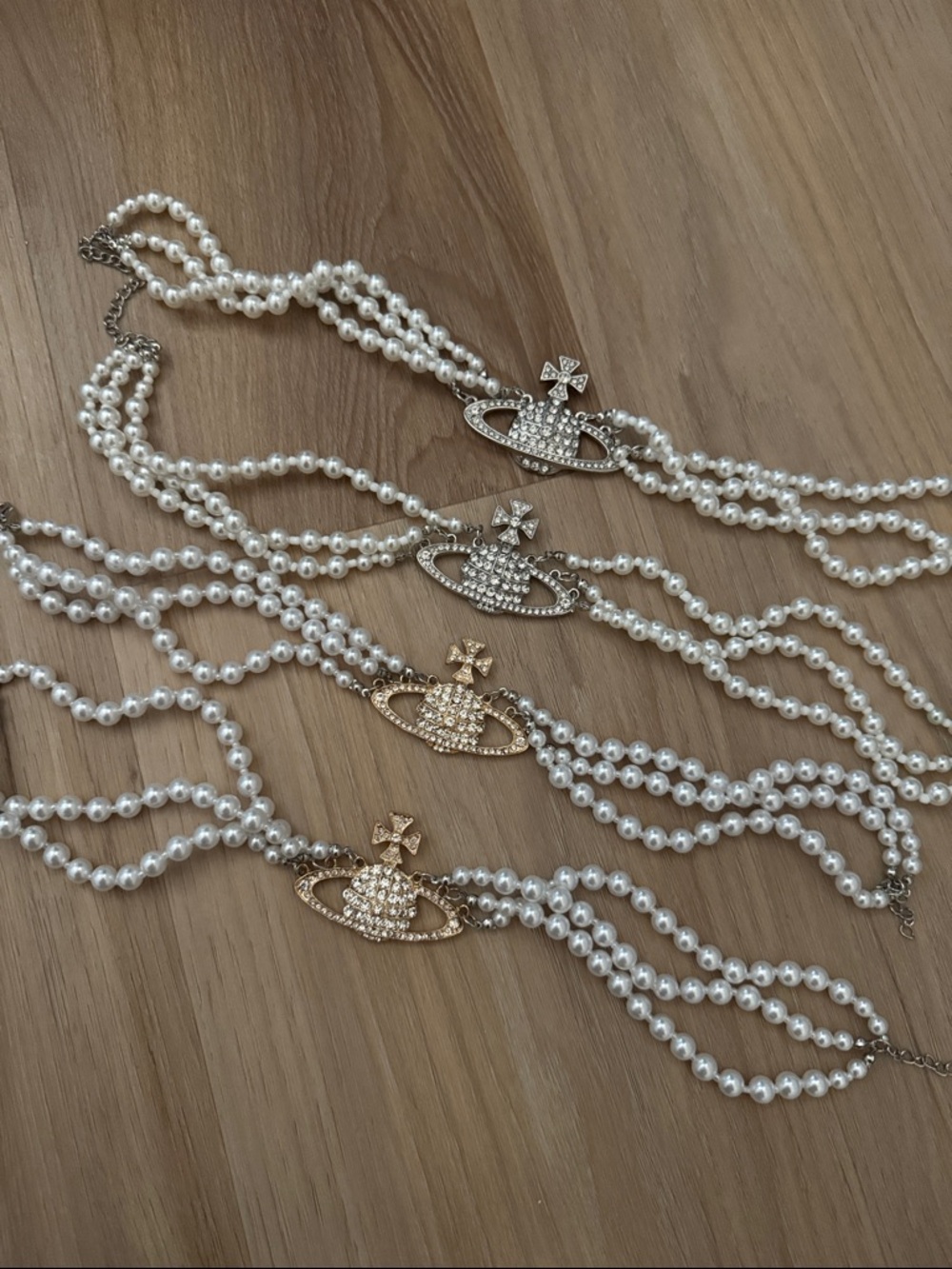 4 pack Saturn pearl necklaces all like brand new